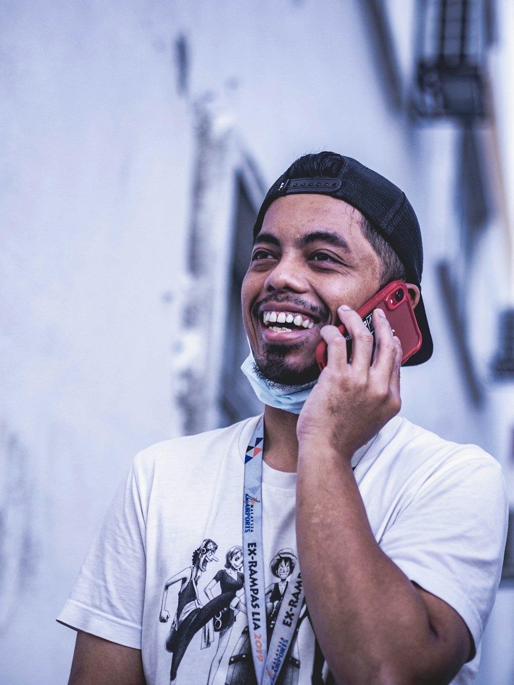 Young man laughing on a phone call